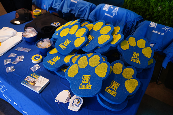 A variety of blue and gold gear was ready for the 51 alumni and supporters who gathered in Arizona in February 2024 to see the Alaska Nanooks take on the Arizona State University Sun Devils. Photo by Shayna Goldberg.