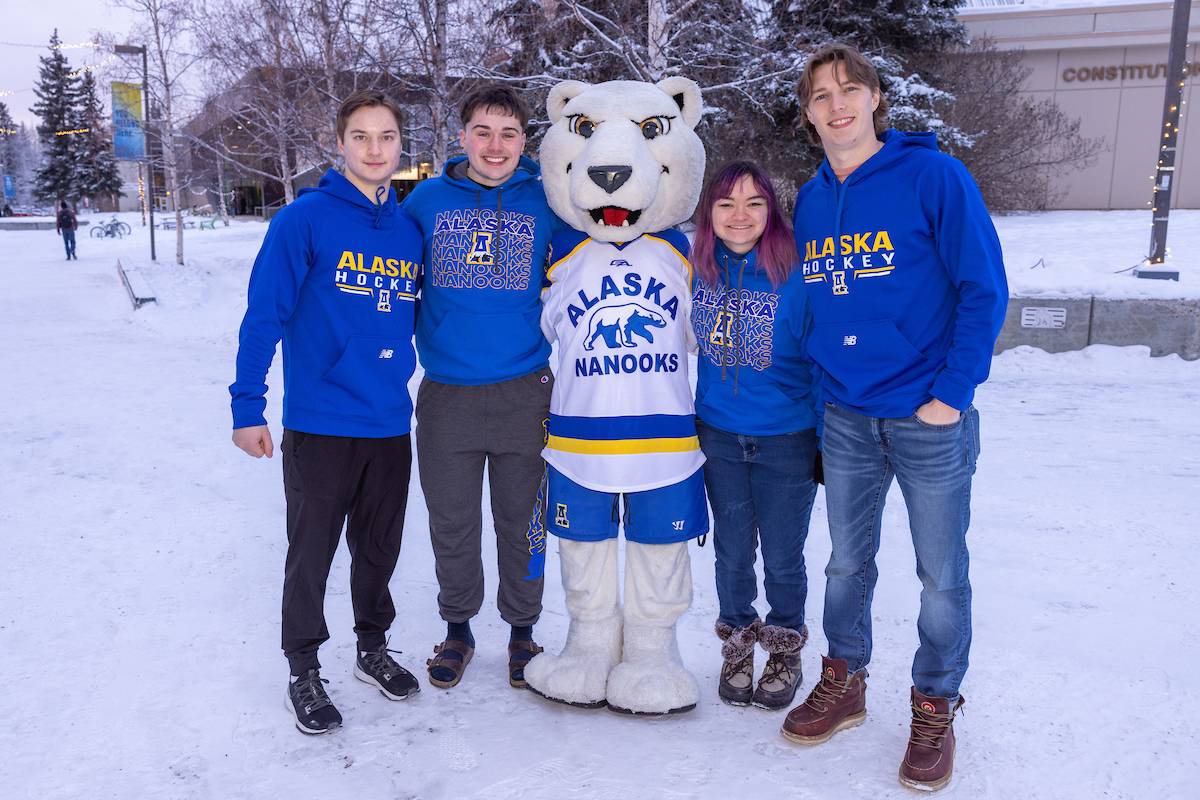 51 students pose with the Nanook mascot